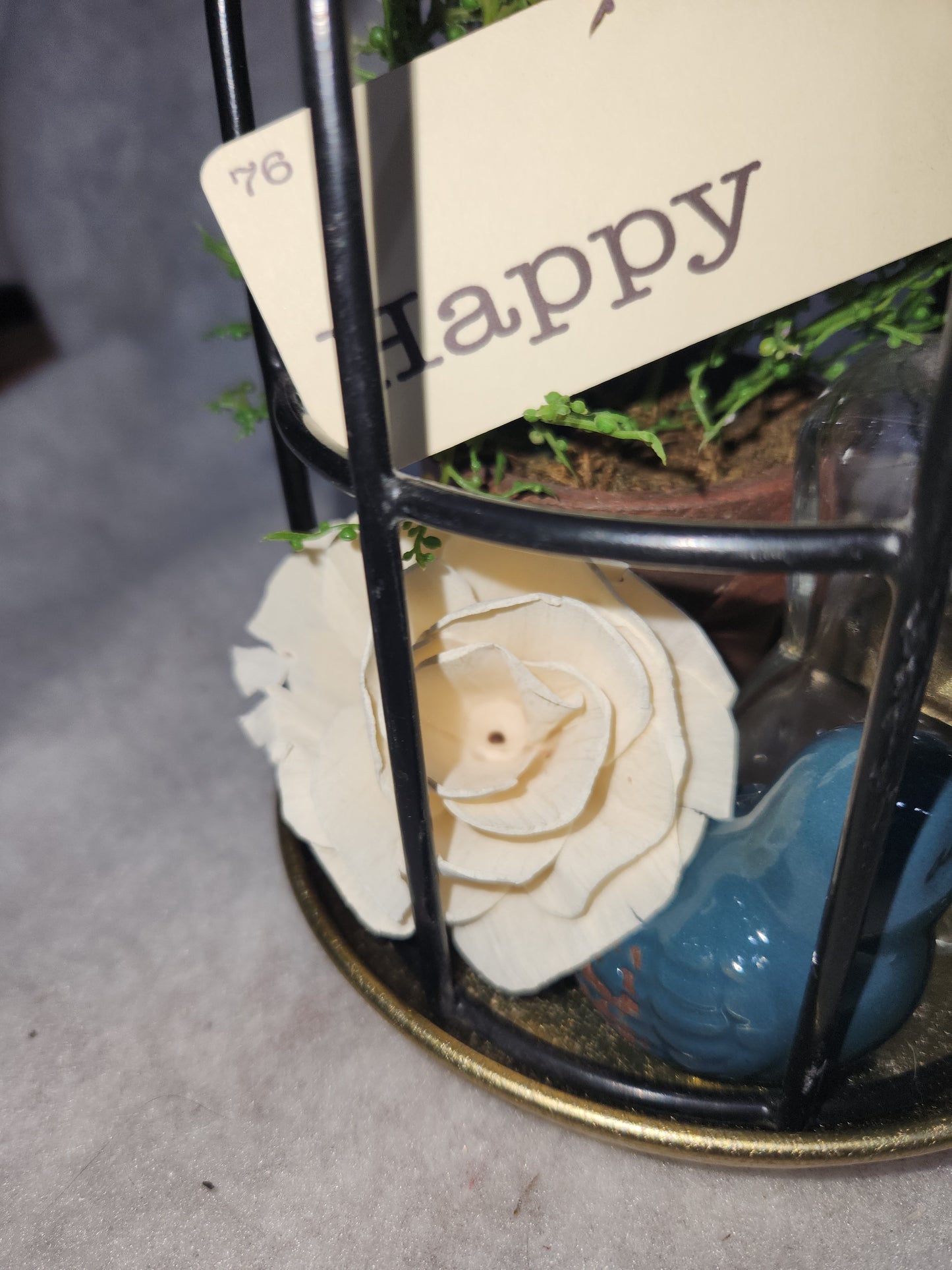 Assemblage light fixture, bottle, bird, plant, wood flower, flashcard