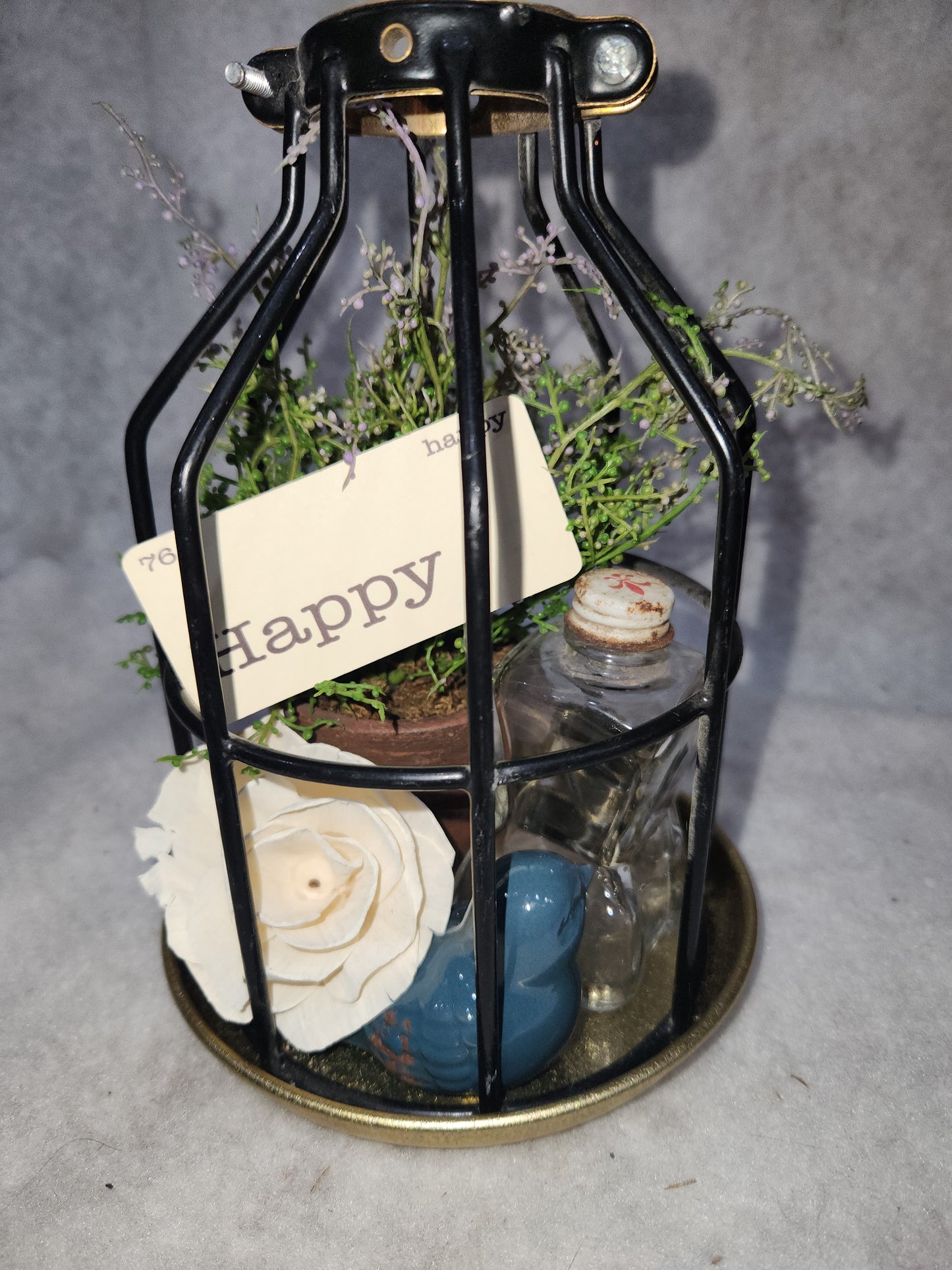 Assemblage light fixture, bottle, bird, plant, wood flower, flashcard