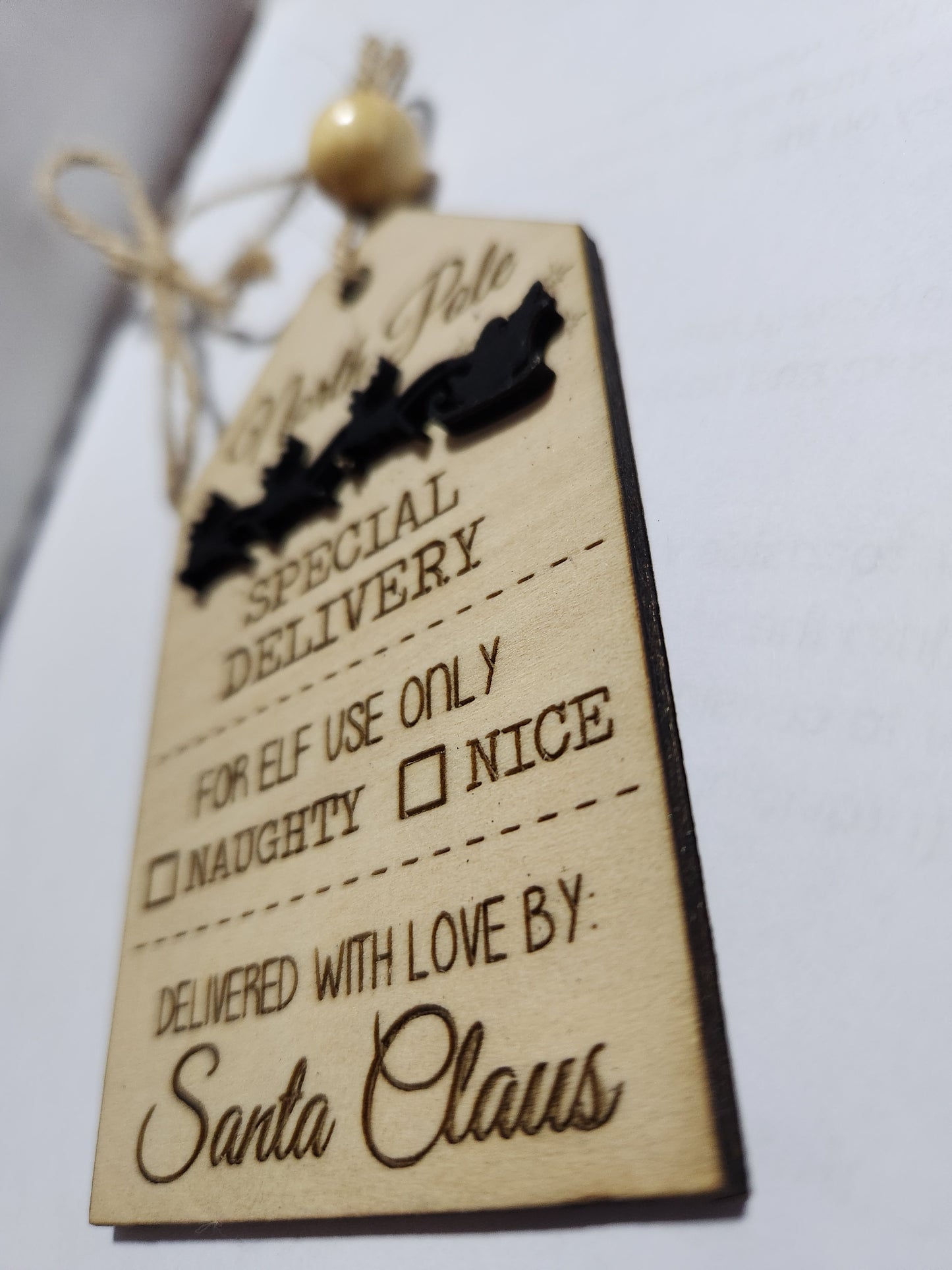 Wooden ornament or car charm.  North Pole special delivery.  Elf use.