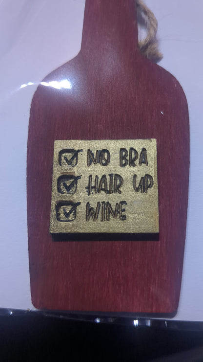 Ornament or car charm. Check No Bra. Check Hair up. Check Wine. Wine bottle