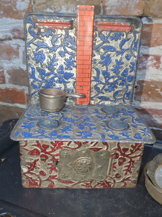 Antique German embossed wood stove with pans. Kid67