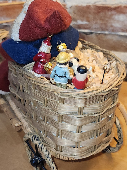 Vintage Bethany Lowe Santa Claus Wearing Wool in a Woven Sleigh With Toys AS IS s90