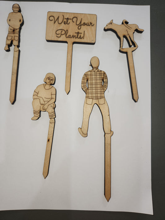 Wet Your Plants potting plant stakes dog, man, woman boy